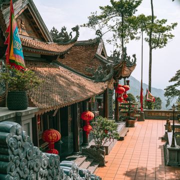 Traditional Chinese architecture with misty mountains showing China ancient culture and natural scenery
